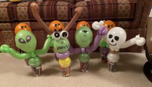 Dracula, Skeleton, bug eye monster and pumpkin balloon gifts.