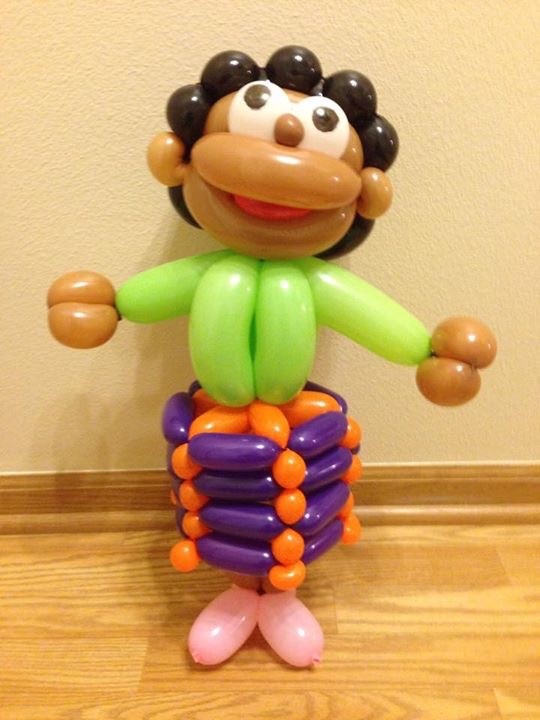 Woman wearing a skirt which is made out of balloons.