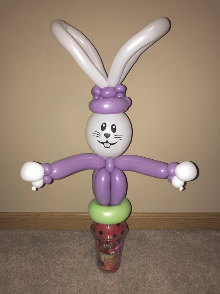 Balloon rabbit wearing a hat made as a  candy cup.
